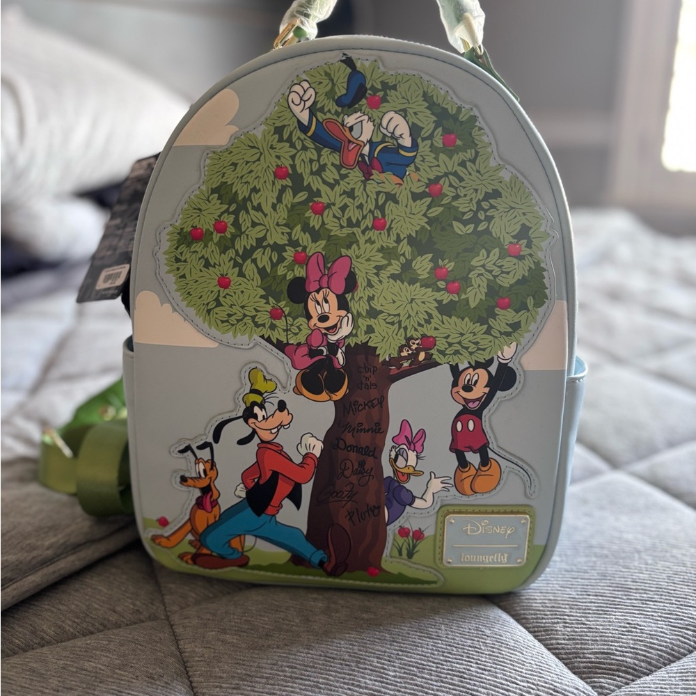 SOLD Loungefly Disney Character Backpack - Green and Blue